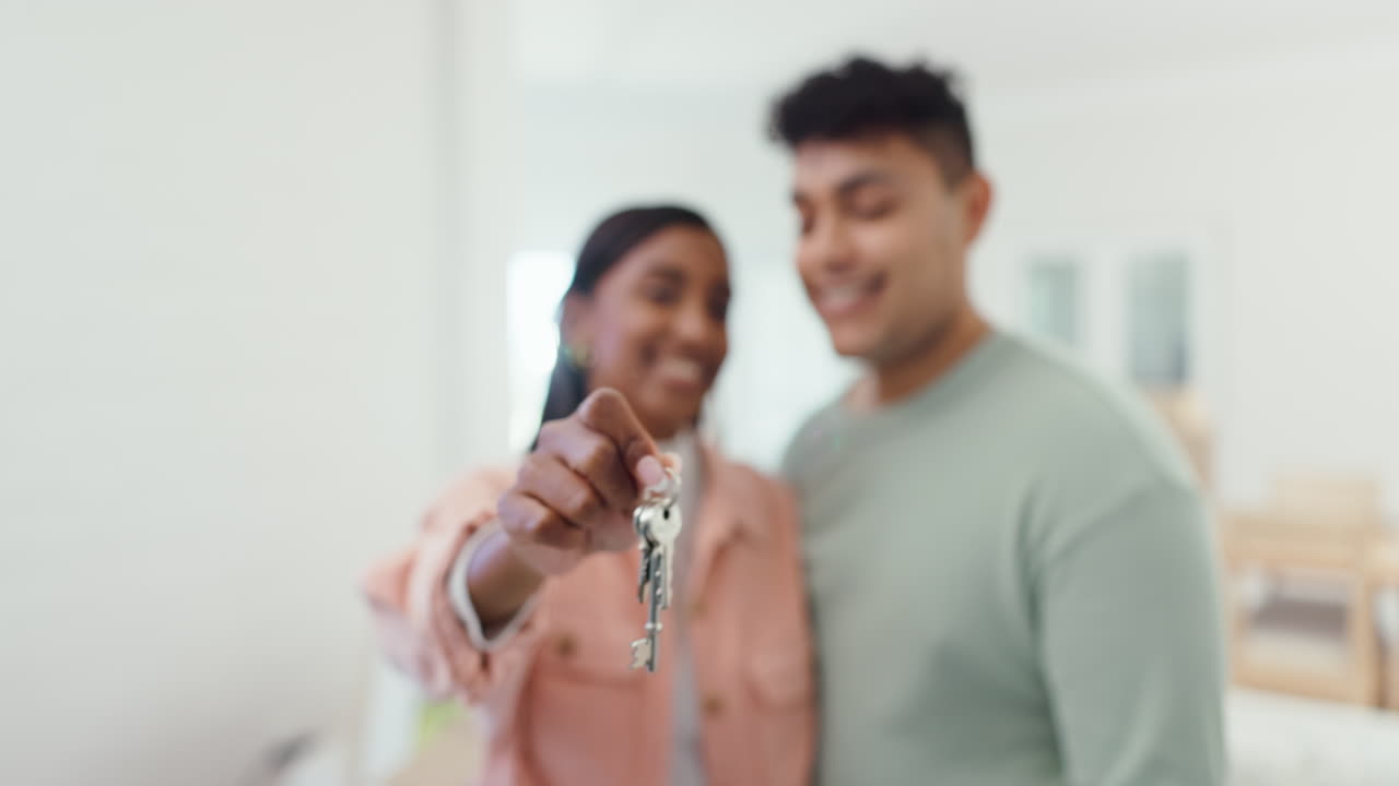 Hands, couple and kiss with keys in new home