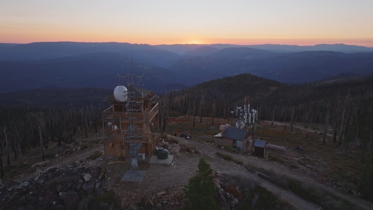 Sunset view with a fire lookout tower in California, conveying solitude