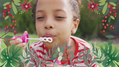 animation of flowers over happy african american girl making soap bubbles