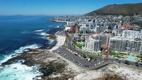 rocky coastline of sea point in cape town south africa on sunny summer day, aerial