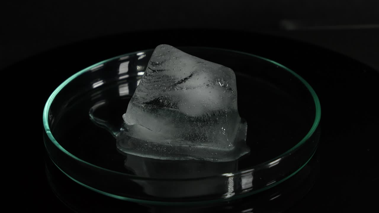 Sequential melting of ice in a clear glass dish