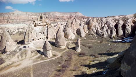 cappadocia turkey's fairy chimneys: aerial drone view of geological pillar rock formations formed by erosion