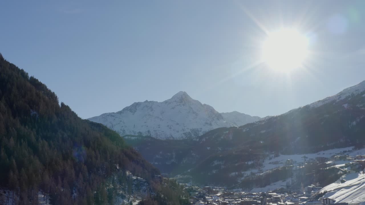 A powerful winter sun shines over the Ötztal Alps, capturing the majestic mountain landscape near Sölden.
