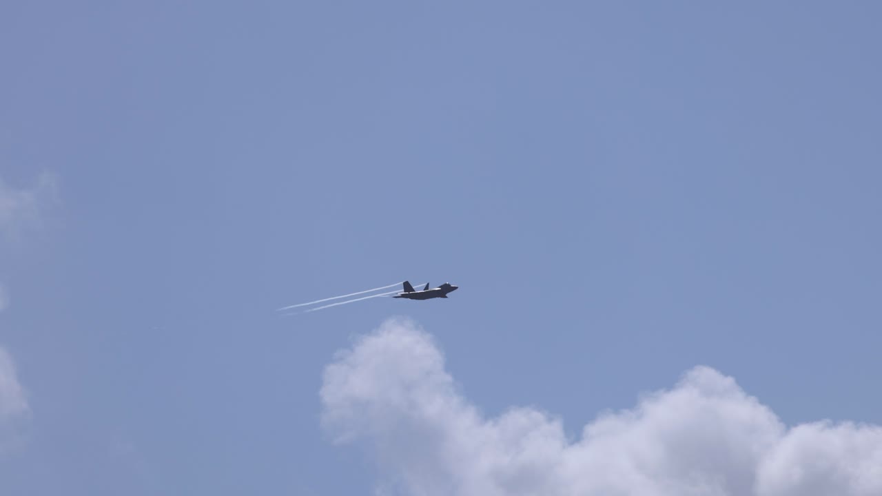 F-35A Lightning II jets soar through clear skies, leaving contrails. Captured at Avalon Airshow, Geelong, Australia