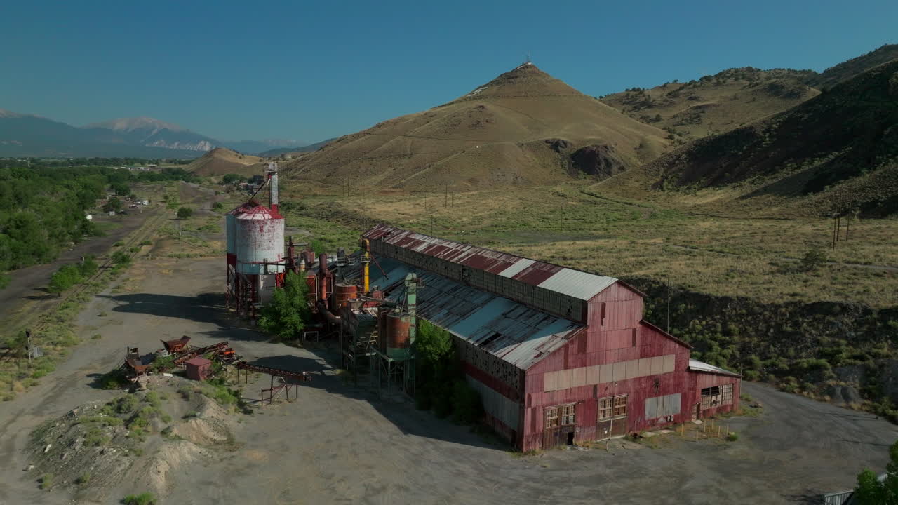 Aerial cinematic drone mid summer downtown Salida S Colorado Lime Mill near Buena Vista on Arkansas River Riverside Park Scout surfing wave biking hiking rafting Rocky Mountain circling movement