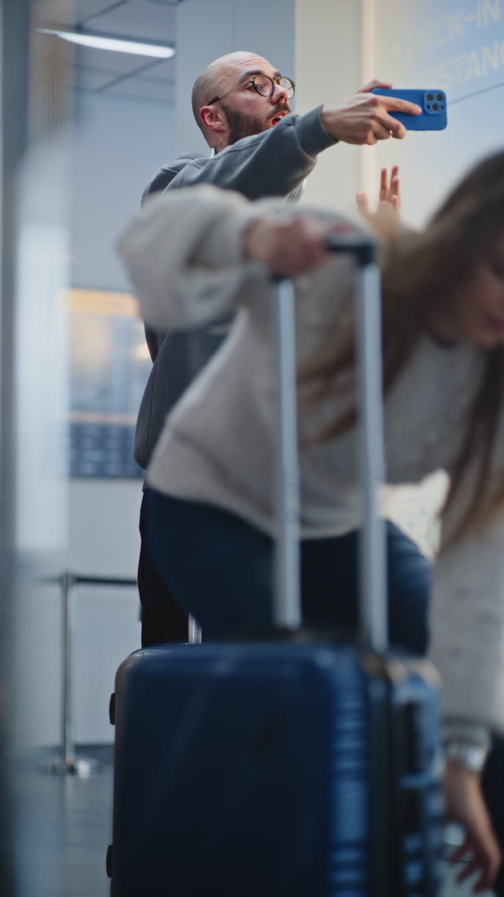 Man Taking Selfie at Airport