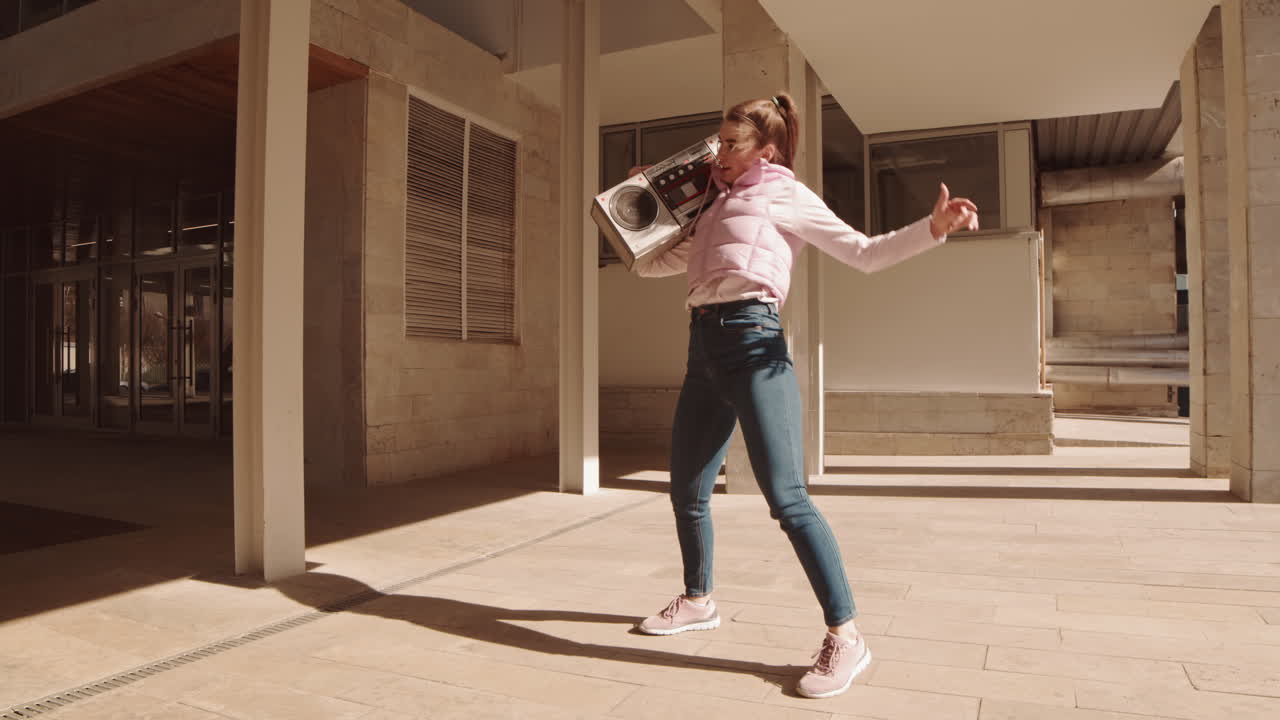 Woman Dancing with Retro Boombox