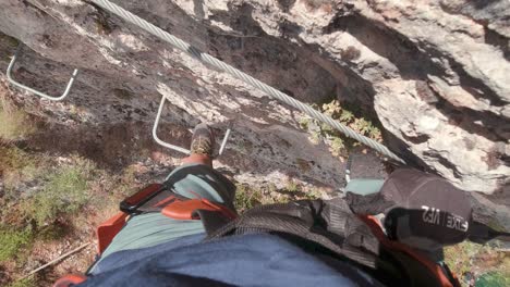 pov action cam joven escalador en via ferrata rock wall-1