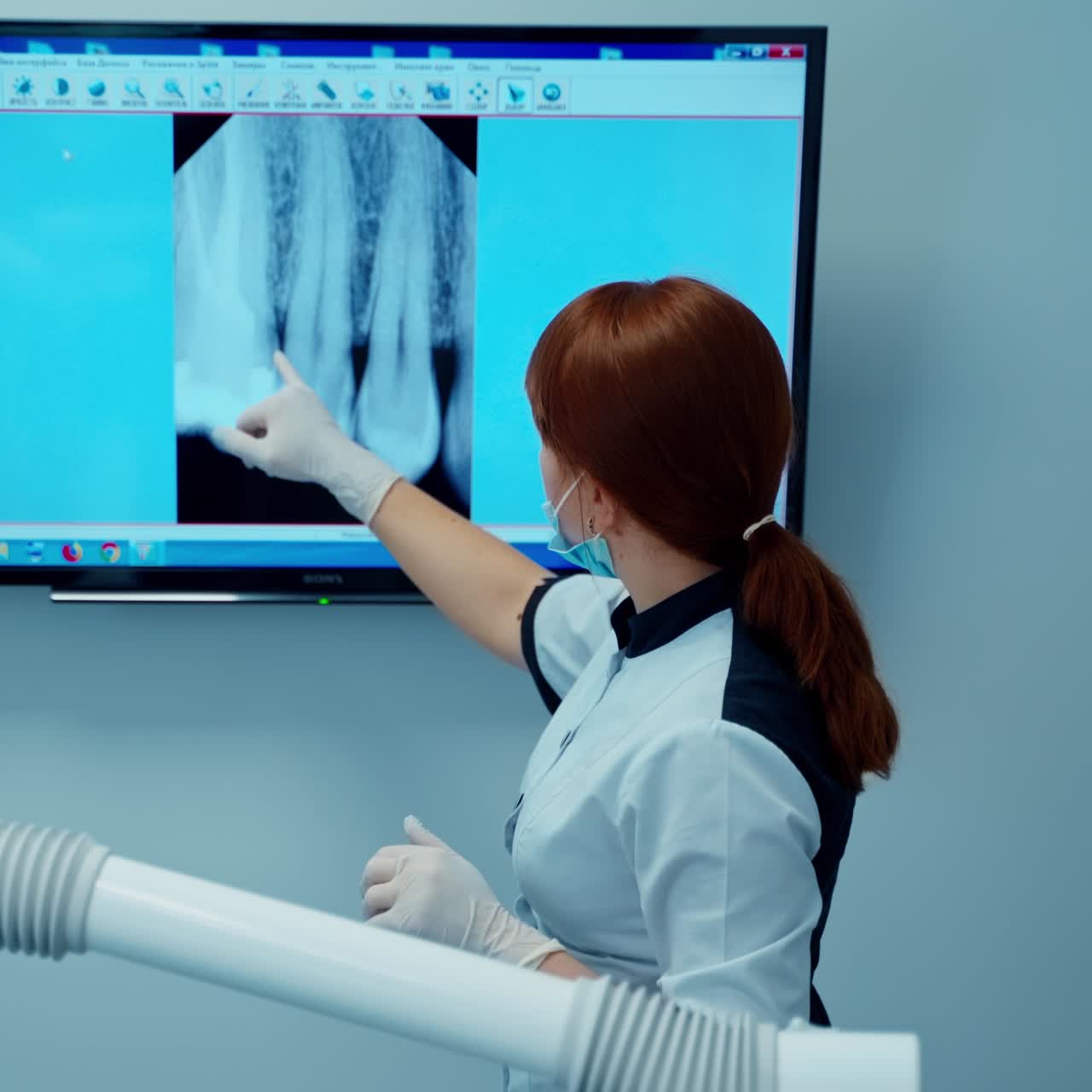 . Medical treatment at the dentist office. Professional dentist working with patient in modern clinic
