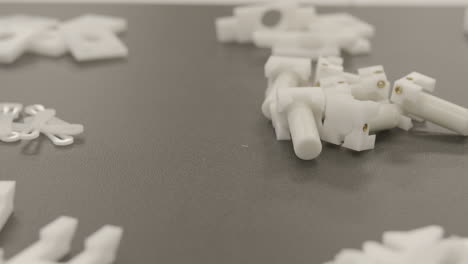 slider shot of 3d printed manufacturing components on a workbench