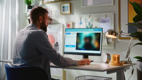 man working on a computer in a home office