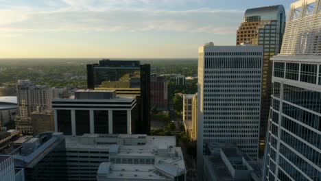 aerial flight above modern buildings in downtown urban city