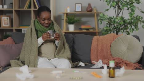 woman with a cold resting on the couch