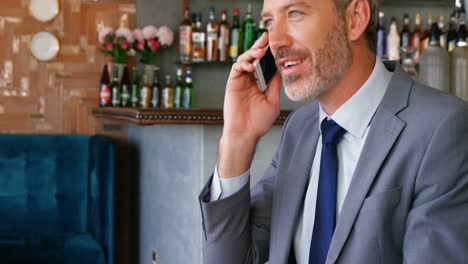 Businessman-talking-on-mobile-phone