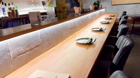 neatly arranged plates and chopsticks on tables