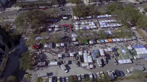 4k aerial drone video of shoppers at farmers market in downtown st