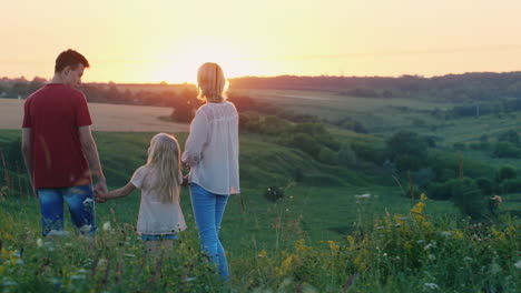 A-Little-Cool-Girl-Runs-To-Meet-The-Sunset-To-Her-Family-Back-View