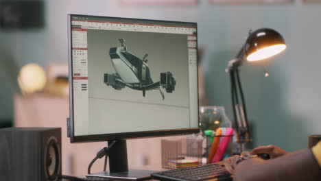 person designing a drone model on a computer
