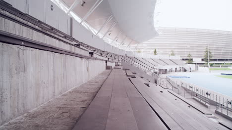 female runner in empty stadium