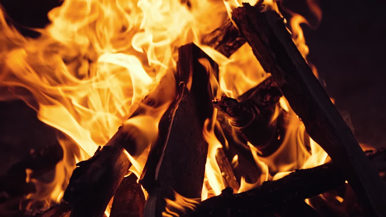 Burning wood in the fireplace and the flames