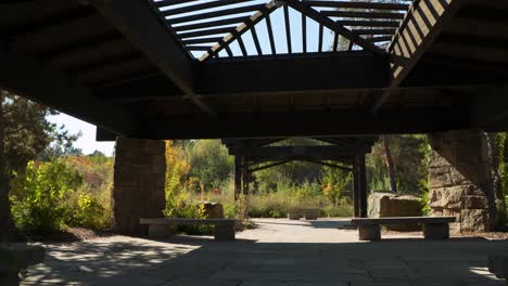 slow pan on a large gazebo with benches and a skylight in boise, idaho on a fall day