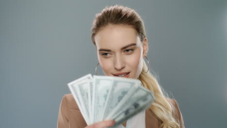 Happy-business-woman-throwing-cash-money