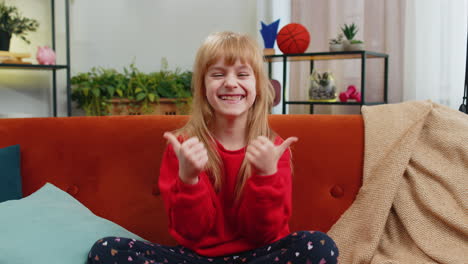 excited child girl surprised shocked by sudden victory good win news celebrating wow reaction