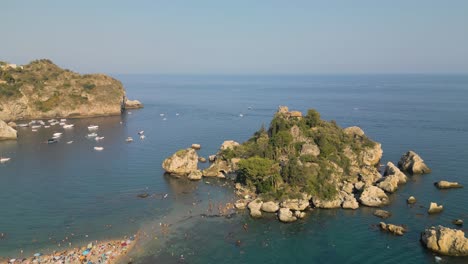 beautiful establishing shot above isola bella - top tourist destination in southern italy