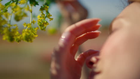 back view of unknown woman touching hair. portrait of unknown female outdoors.