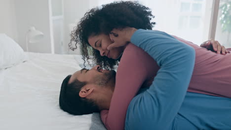 excited, home and couple hug on bed for cuddle