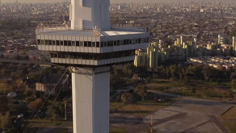 cinematic aerial drone shot of tallest tower in buenos aires city at sunset - tele lens