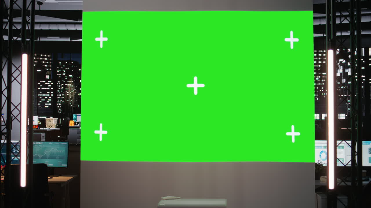 Empty conference room shows a green screen in multinational company office