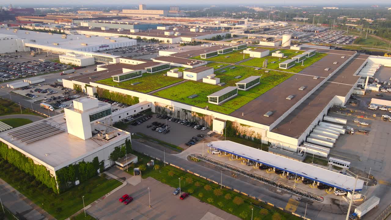 Massive Ford Motors Company facility with green rooftops in Dearborn, Michigan, aerial view