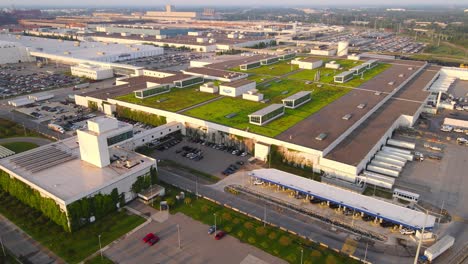 massive ford motors company facility with green rooftops in dearborn, michigan, aerial view