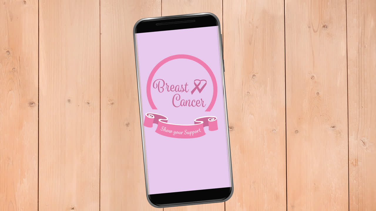 Animazione di un logo a nastro rosa per il cancro con il testo 'cancro' sullo schermo di uno smartphone.
