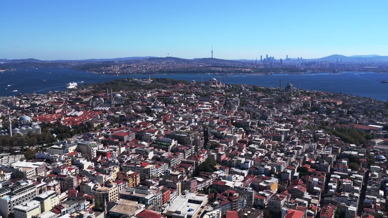 Istanbul Turkey Türkiye the Golden Horn Blue Mosque temple Hagia Sophia Grand Mosque aerial drone morning blue sky cityscape buildings Bosphorus Strait river ferries boats harbor view circle left