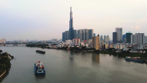 Drone-hyperlapse-over-the-river-to-Landmark-81,-Ho-Chi-Minh-City,-Vietnam