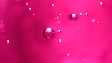 abstract science or art background with pink bubbles rising