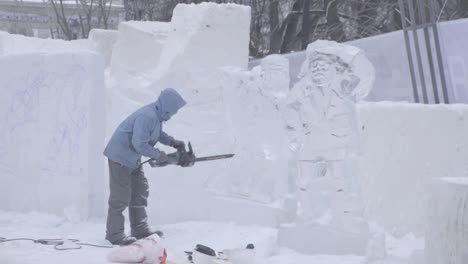 ice carving artist at a winter festival