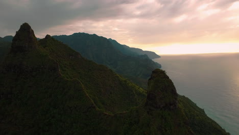 aerial footage of the lush mountains of kauai, hawaii usa filmed at sunset