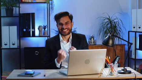 happy amazed businessman shocked by sudden victory game winning lottery goal achievement good news