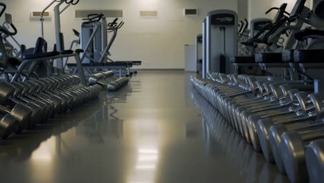 gym with fitness equipment and dumbbells
