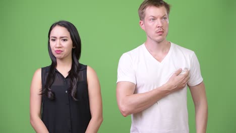 young asian businesswoman and smelly young man