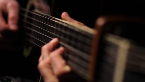 guy playing guitar showing both hands