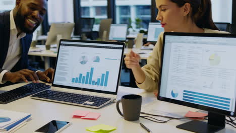 business professionals collaborating on data analysis in a modern office