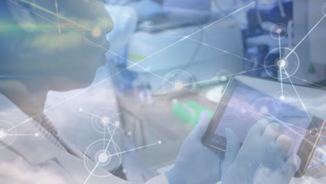animation of network of connections over biracial female lab worker using tablet
