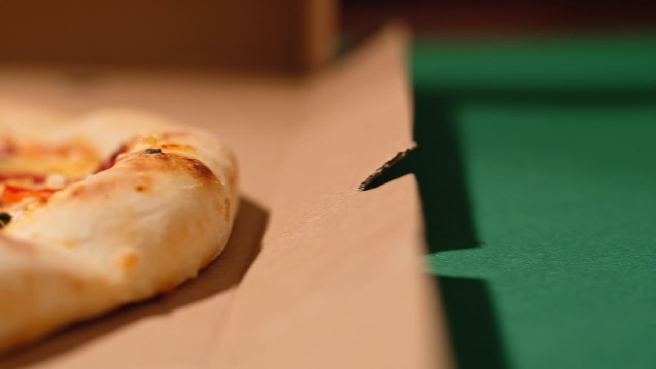 Close up view of pizza with hunter sausage in warm light