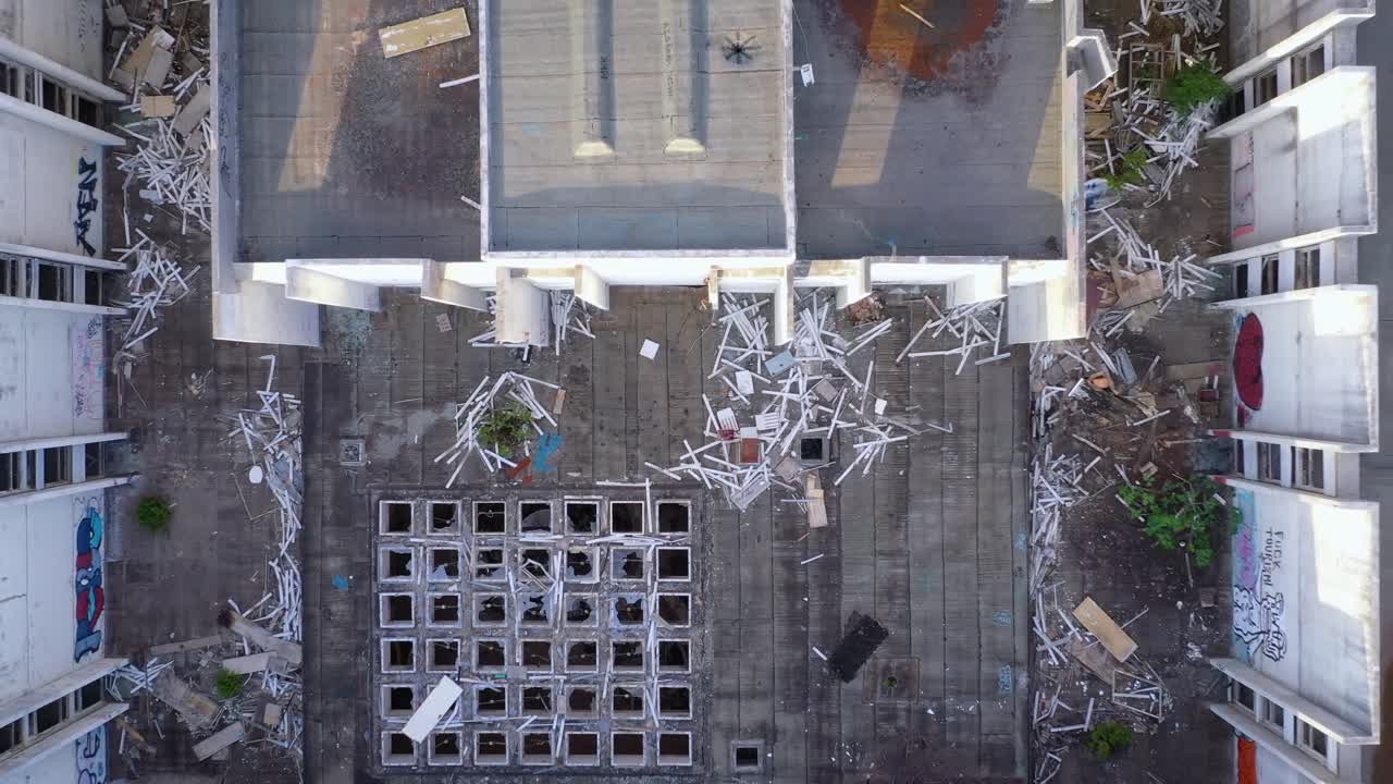 Aerial zoom in towards debris filled inner courtyard of Haludovo Palace Hotel