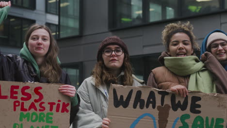 group of young female activists with banners protesting against climate change 5