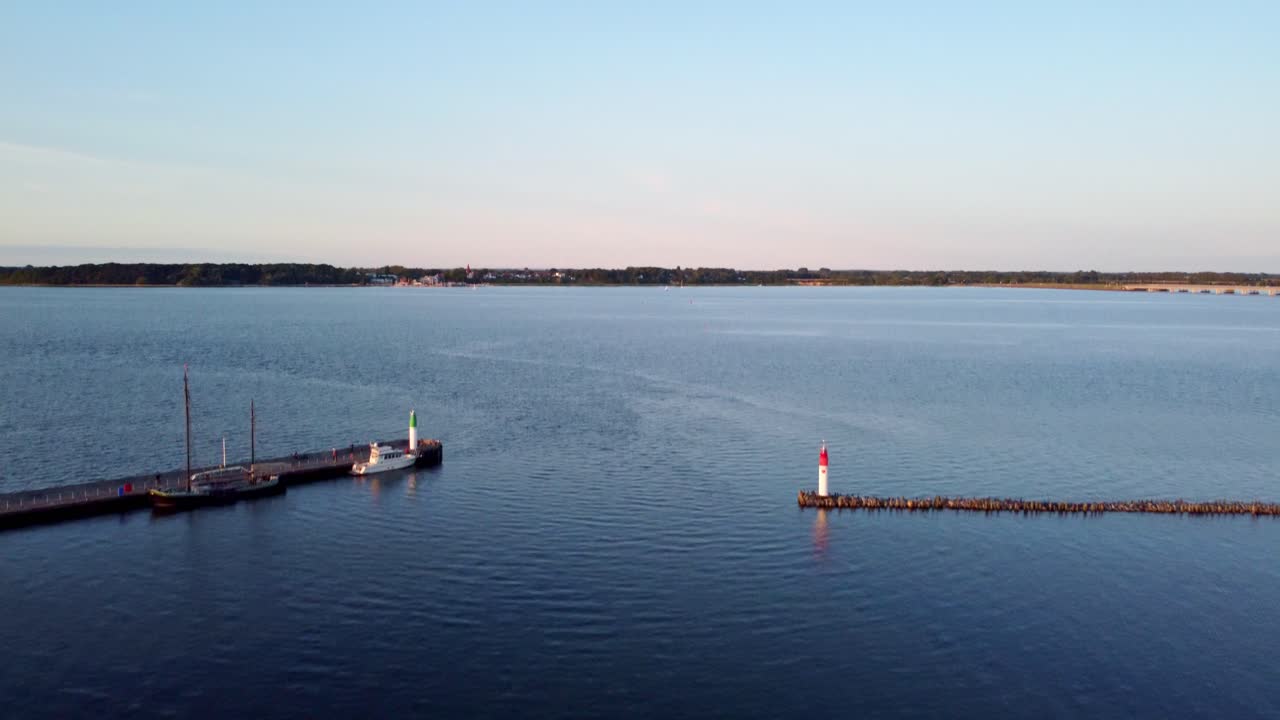 entrance to the port marina, reveal view, sea, and island